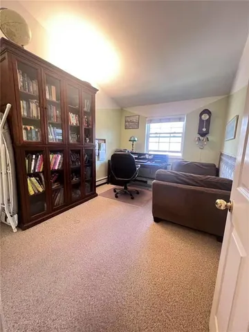a bedroom with furniture and a window