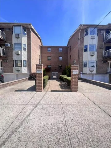 a view of a building with sitting area