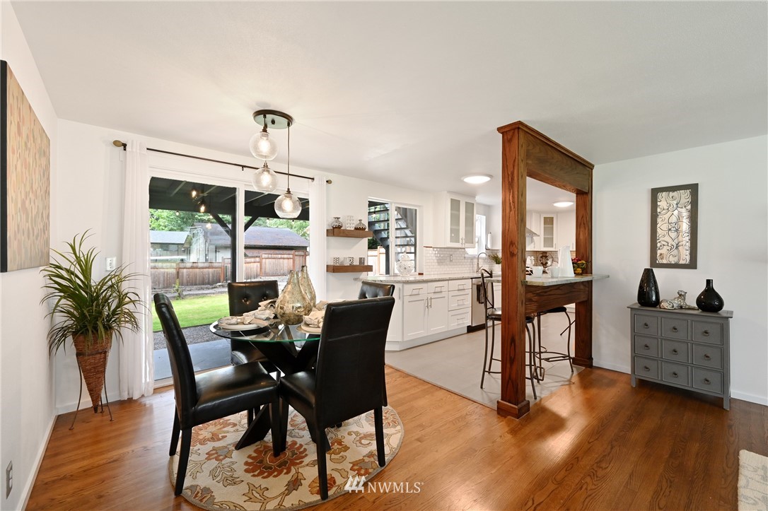 24202 3rd Place West Bothell, WA 98021 - Photo 8 of 31 a view of a dining room with furniture and chandelier