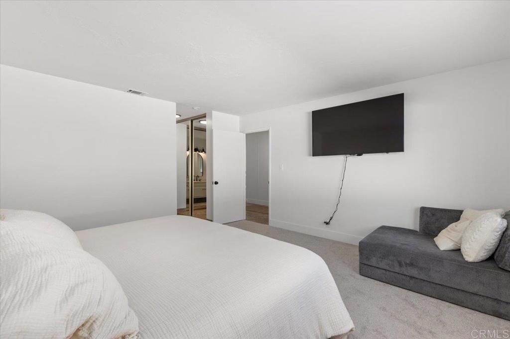 1267 Discovery Street San Marcos, CA 92078 - Photo 13 of 75 a bedroom with a bed and a flat screen tv