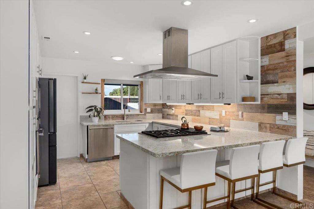 1267 Discovery Street San Marcos, CA 92078 - Photo 26 of 75 a kitchen with stainless steel appliances granite countertop a sink and cabinets