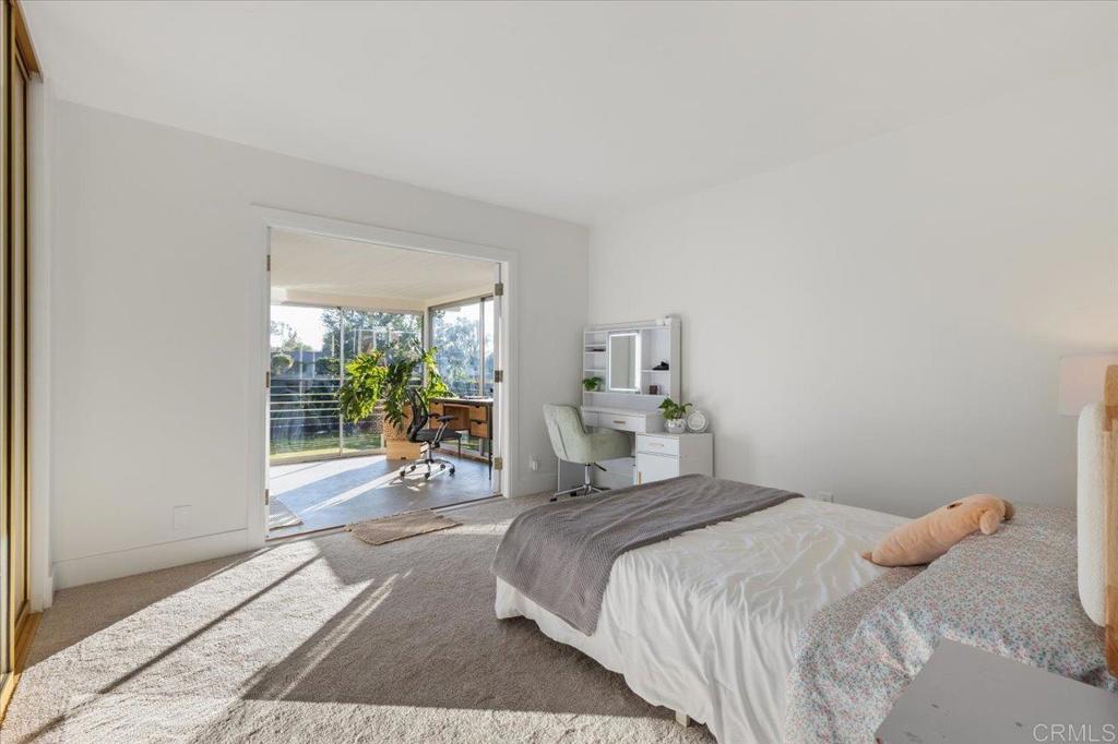 1267 Discovery Street San Marcos, CA 92078 - Photo 30 of 75 a bedroom with a bed and a large window