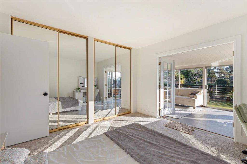 1267 Discovery Street San Marcos, CA 92078 - Photo 31 of 75 a bedroom with a bed and large windows