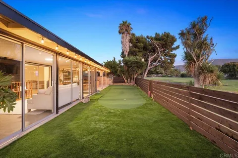 an aerial view of river residential houses with outdoor space