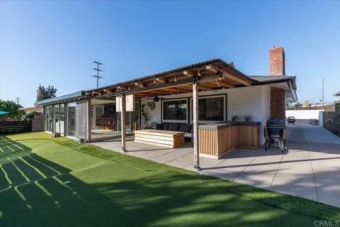 a view of an ocean building and trees in the background