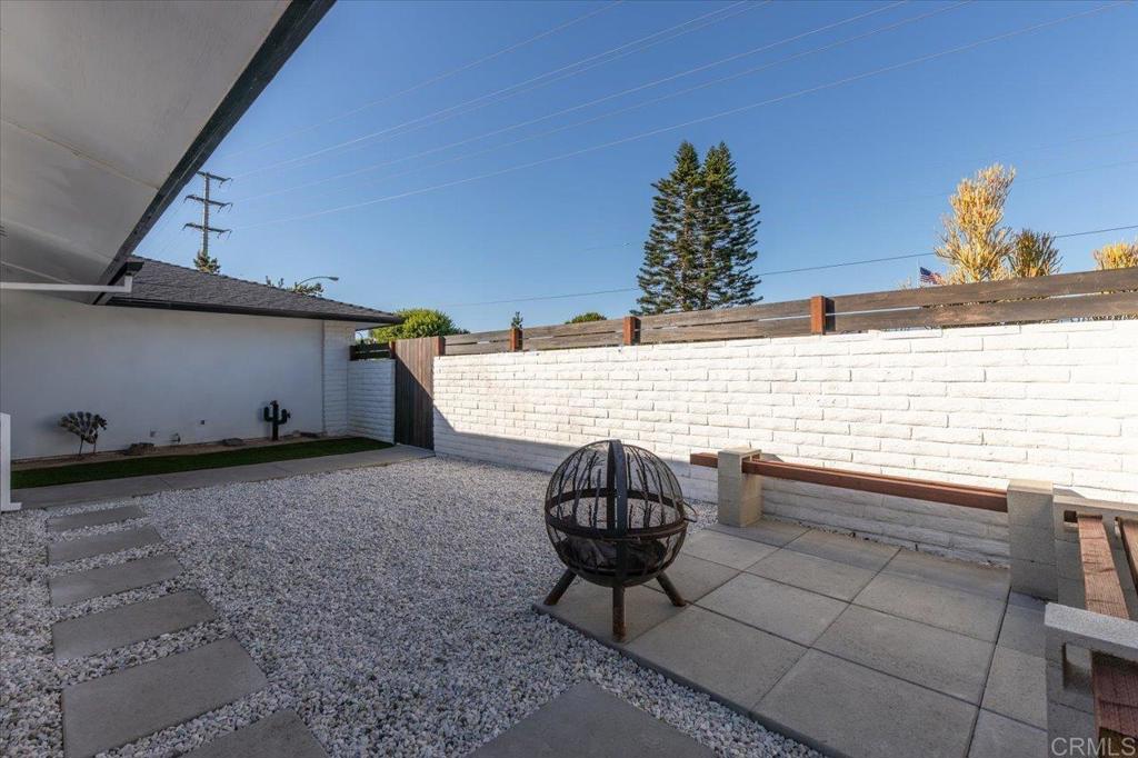 1267 Discovery Street San Marcos, CA 92078 - Photo 7 of 75 a picture of a table and chair in the patio