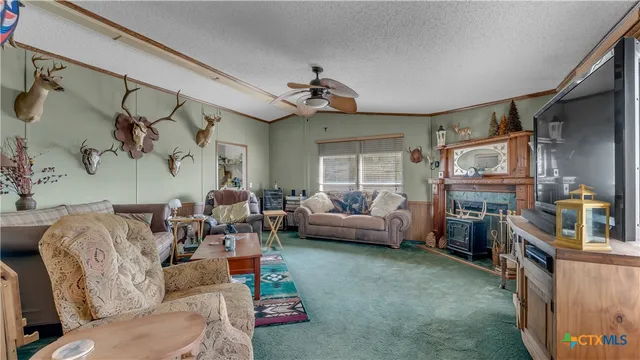 a living room with furniture a couch and a window