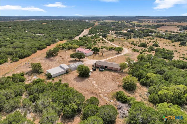 an aerial view of residential house with outdoor space