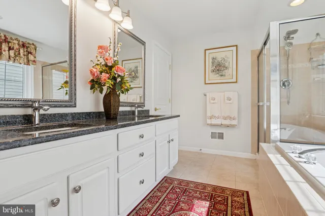 a bed room with a bed and a chair