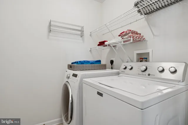 a bathroom with a bathtub and next to a window