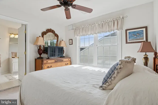 a bedroom with bed and a window