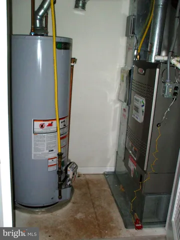 a view of a street sign under a large tree