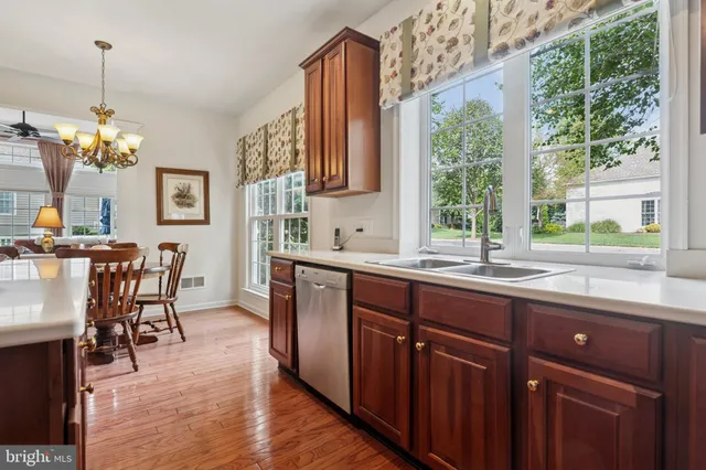 a kitchen with a sink and wooden cabinets