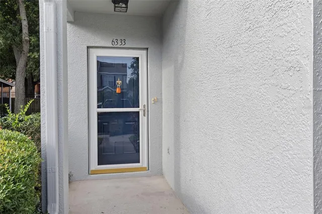 a view of a hallway with front door