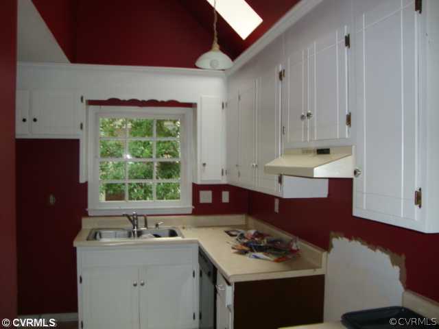 5810 Laurel Trail Road Midlothian, VA 23112 - Photo 3 of 4 a kitchen with stainless steel appliances granite countertop a stove a sink and a refrigerator