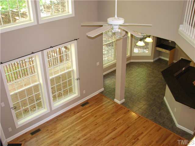 5029 Bartons Enclave Lane Raleigh, NC 27613 - Photo 5 of 25 wooden floor in an empty room with a window