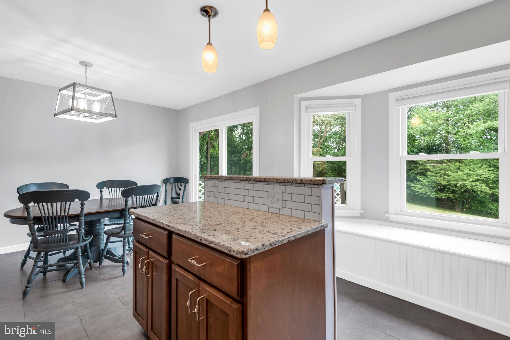 644 Jasontown Road Westminster, MD 21158 - Photo 13 of 36 a view of a kitchen area with furniture and window