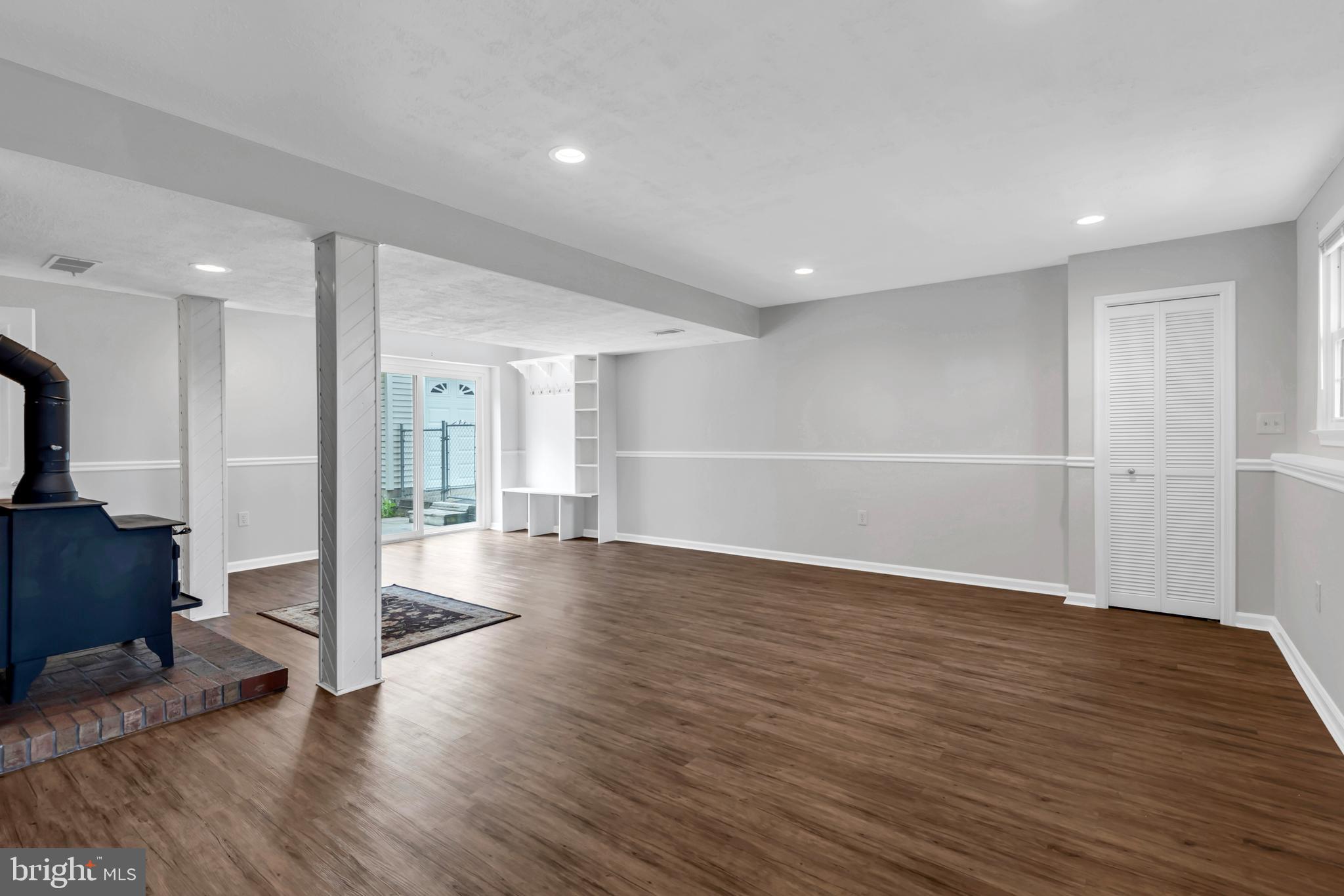 644 Jasontown Road Westminster, MD 21158 - Photo 25 of 36 a view of a big room with wooden floor and windows
