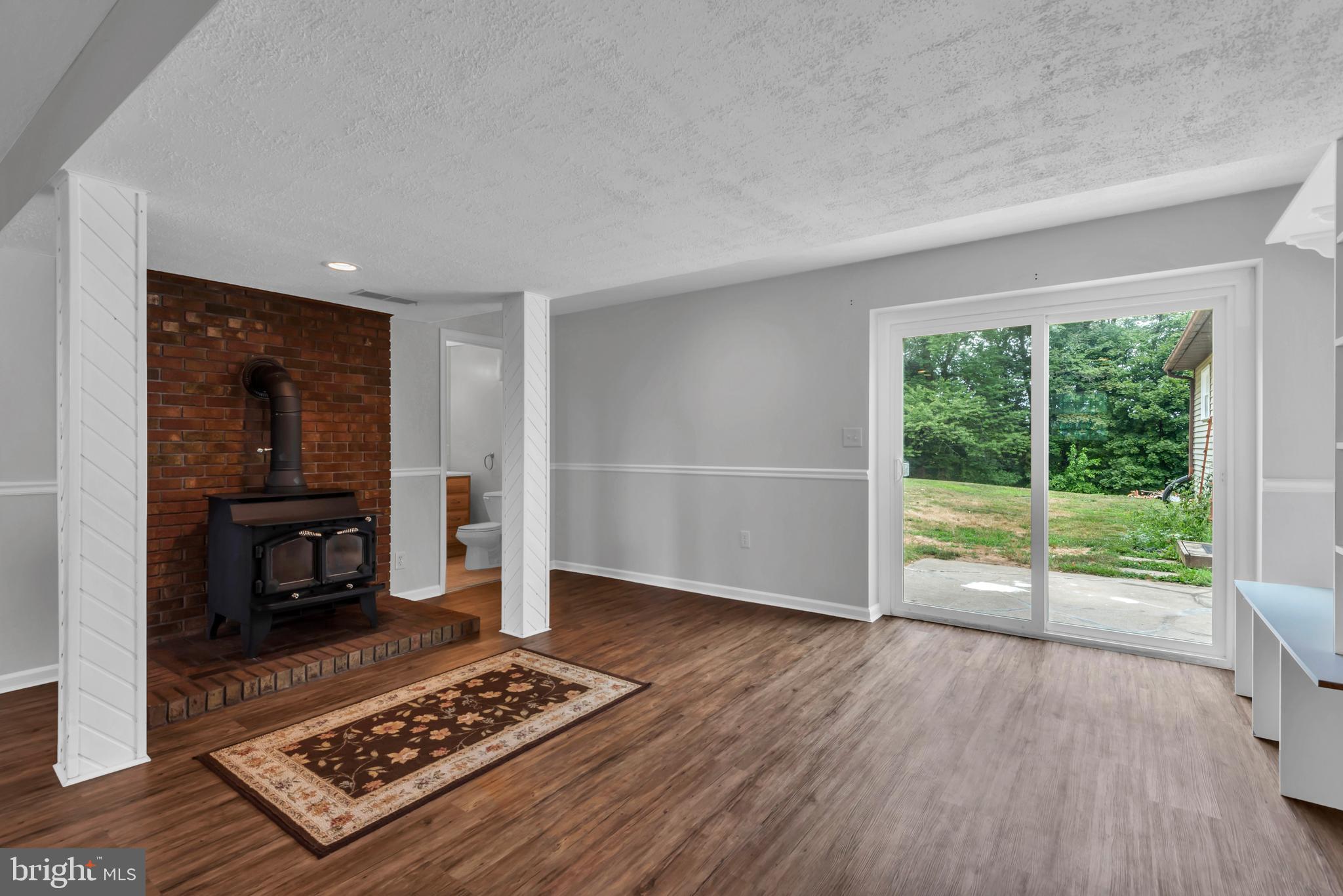 644 Jasontown Road Westminster, MD 21158 - Photo 27 of 36 a living room with furniture and a fireplace