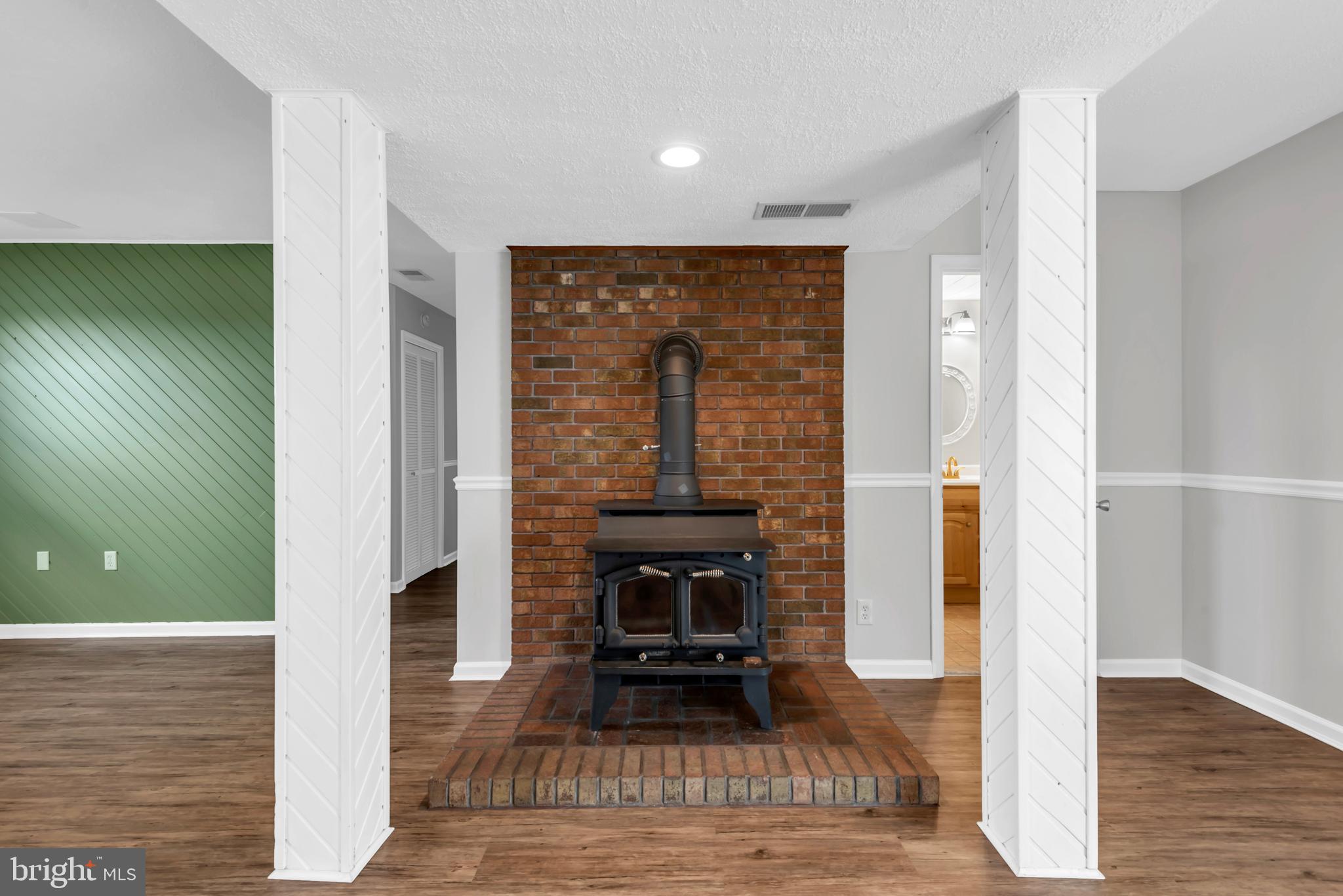 644 Jasontown Road Westminster, MD 21158 - Photo 28 of 36 a living room with a fireplace