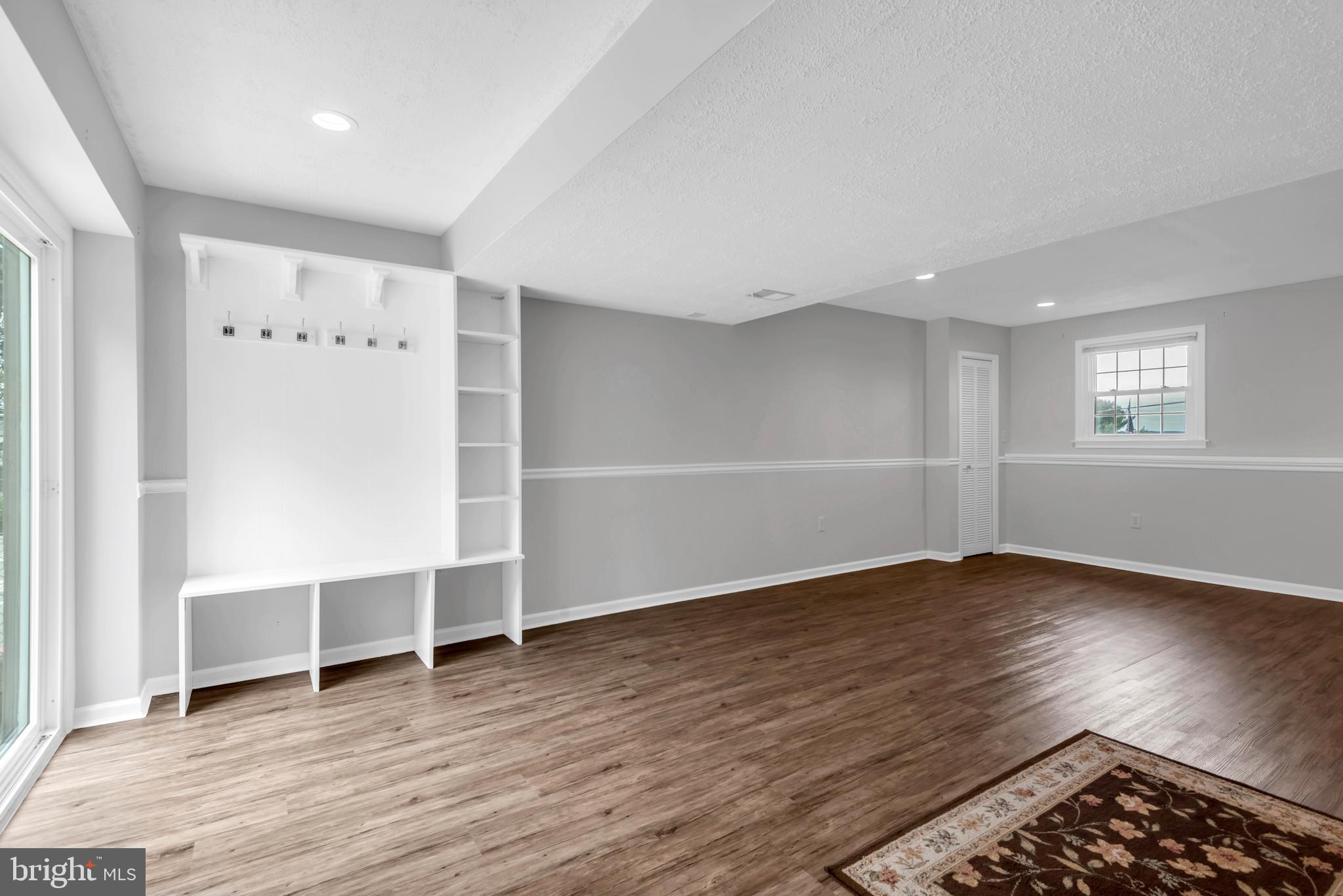 644 Jasontown Road Westminster, MD 21158 - Photo 29 of 36 an empty room with wooden floor and windows