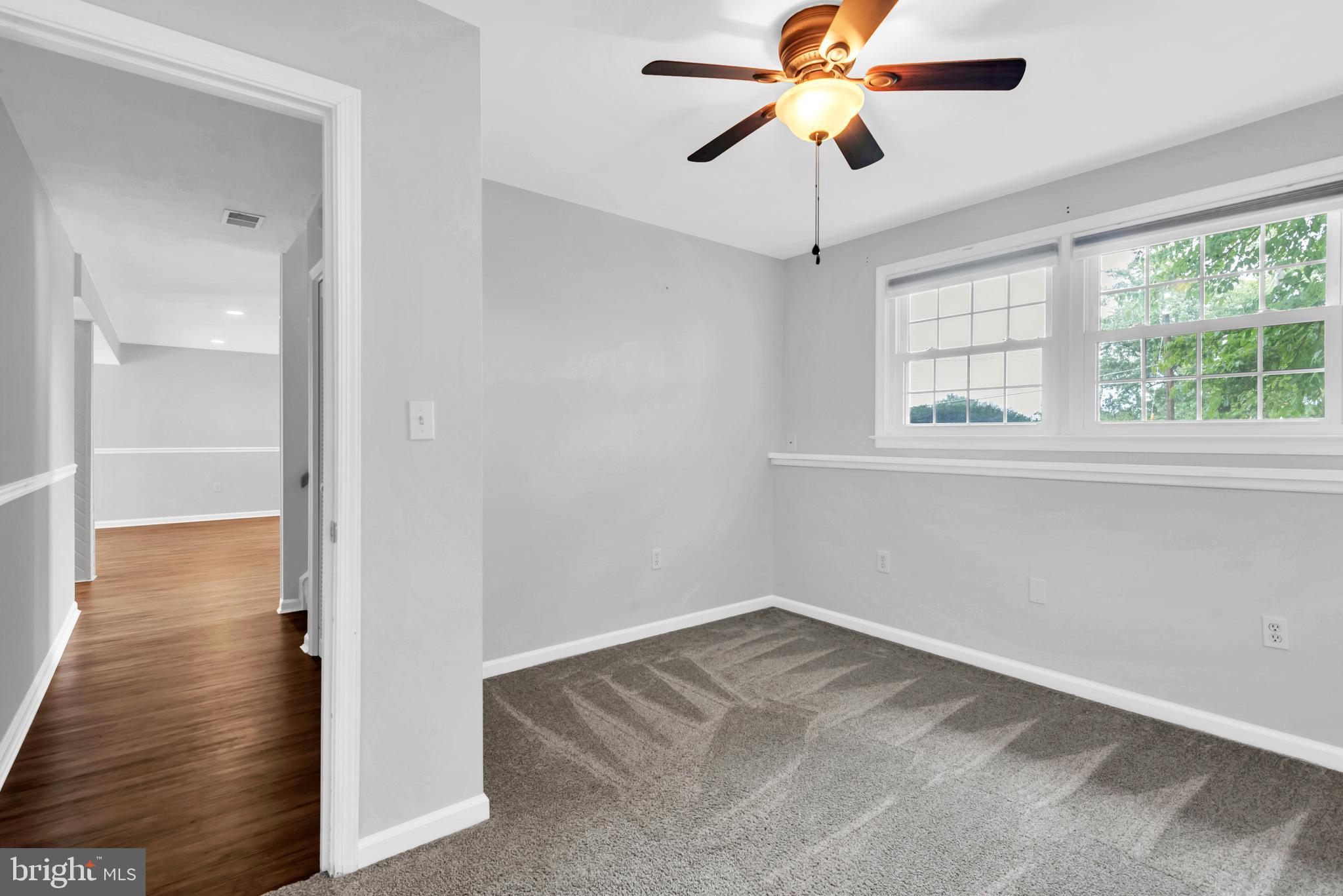 644 Jasontown Road Westminster, MD 21158 - Photo 30 of 36 a view of empty room with wooden floor and fan