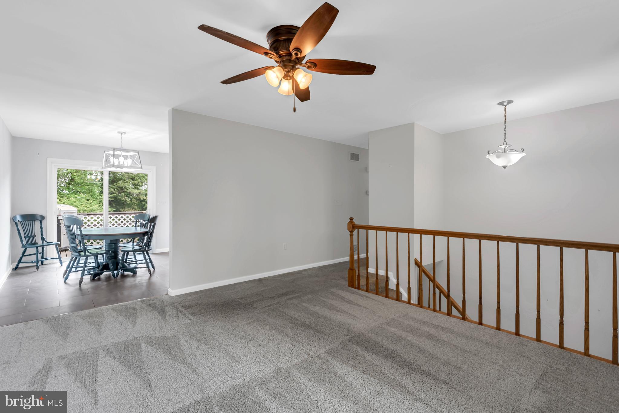 644 Jasontown Road Westminster, MD 21158 - Photo 6 of 36 a view of a livingroom with furniture and a ceiling fan