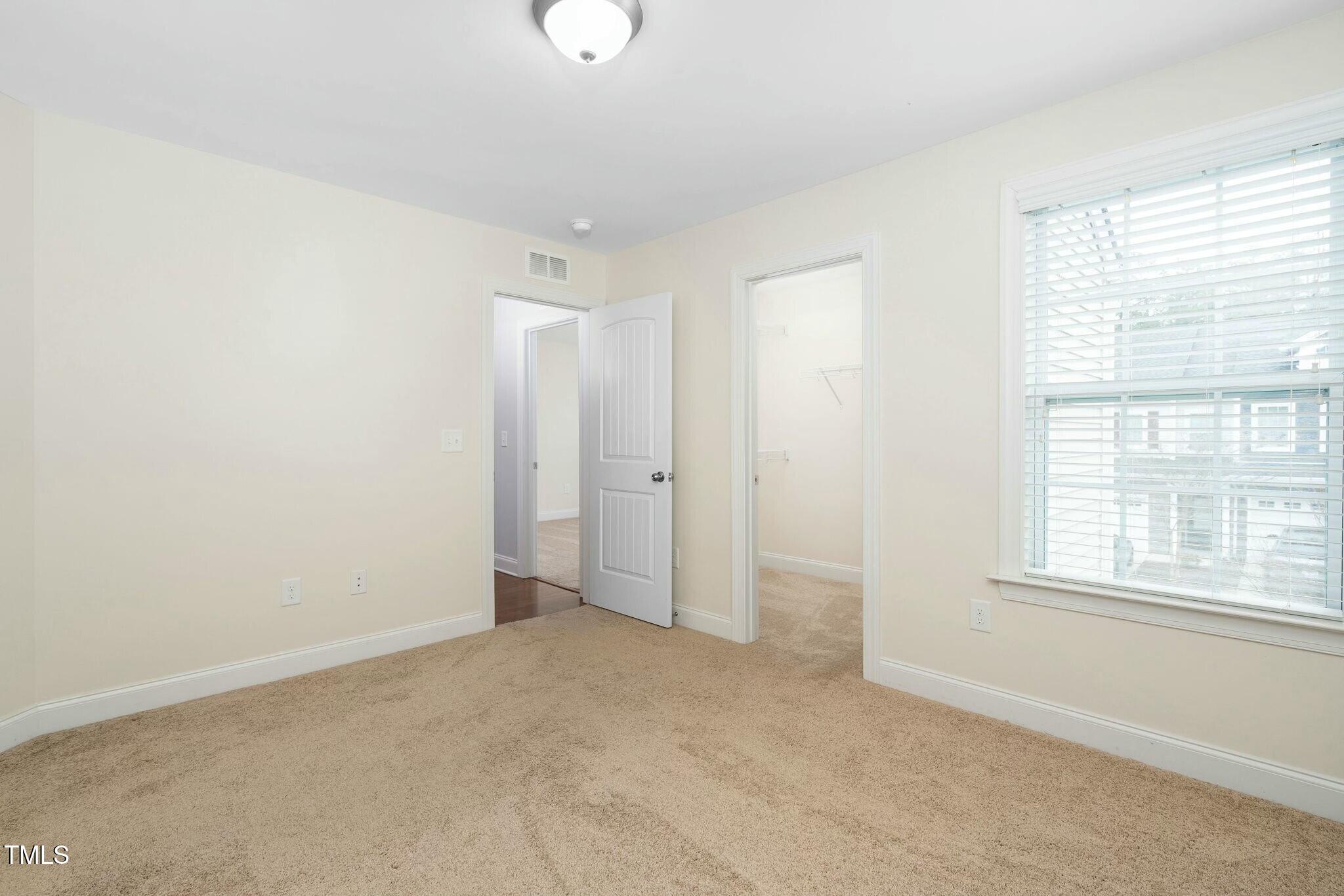 1052 Monmouth Loop Cary, NC 27513 - Photo 30 of 37 an empty room with a empty space and windows