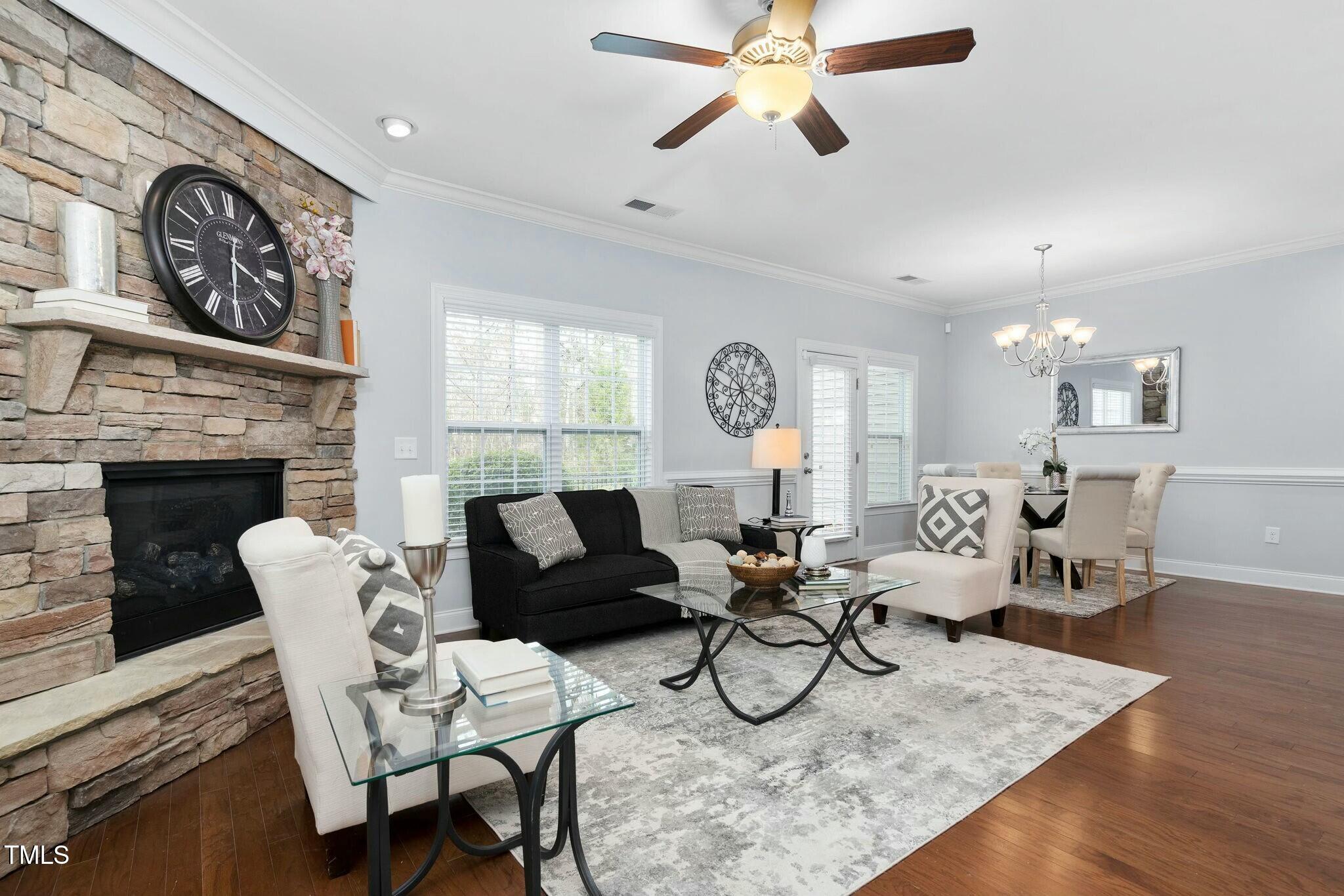 1052 Monmouth Loop Cary, NC 27513 - Photo 4 of 37 a living room with furniture and a fireplace