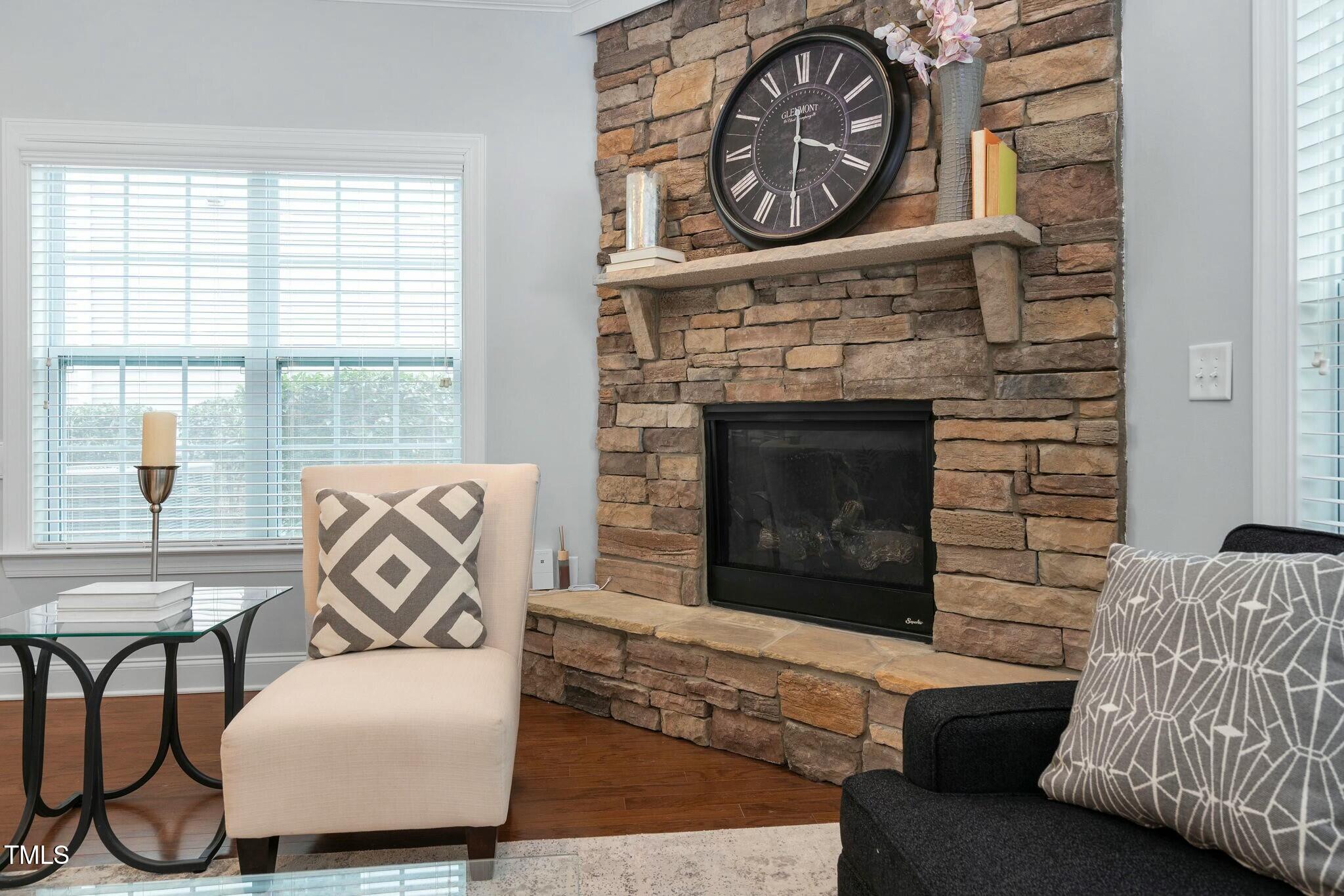 1052 Monmouth Loop Cary, NC 27513 - Photo 6 of 37 a living room with furniture and a fireplace