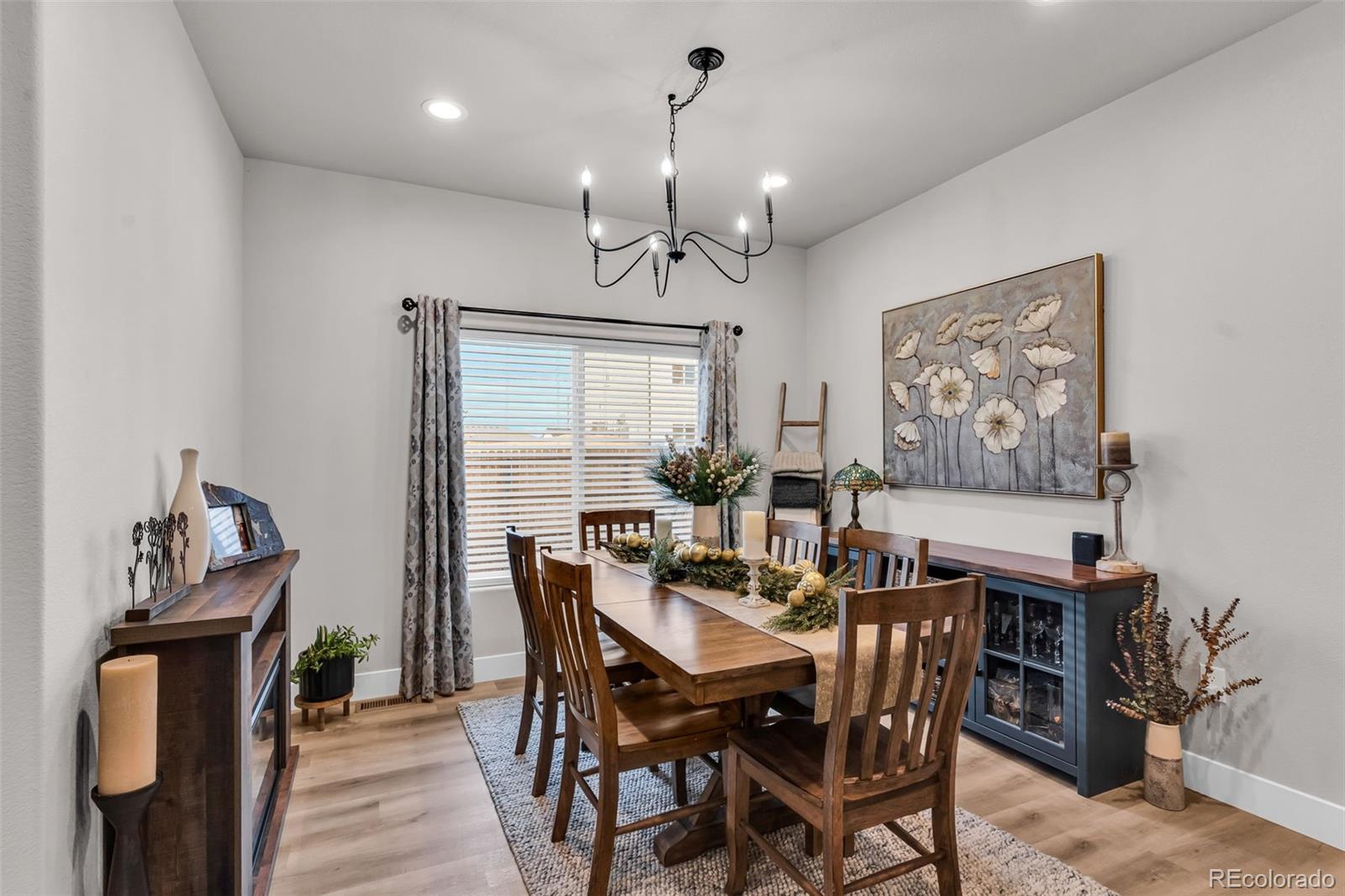 425 Miners Road Canon City, CO 81212 - Photo 17 of 33 a view of a dining room with furniture window and wooden floor
