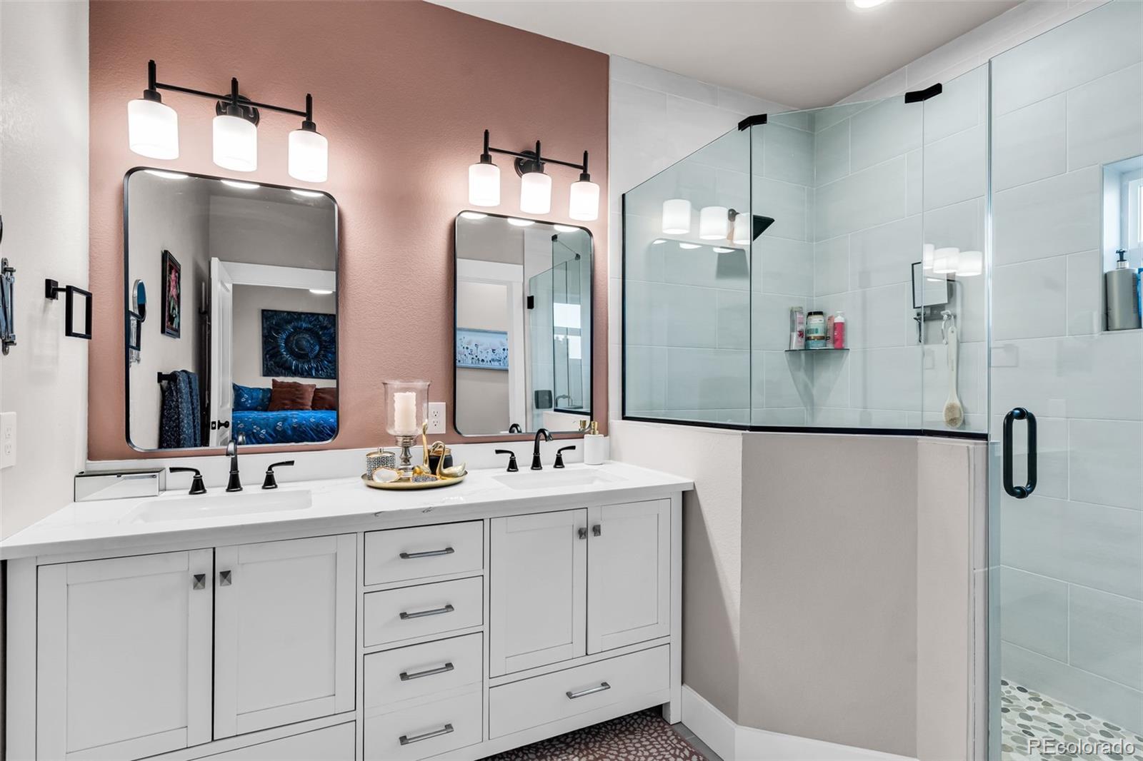 425 Miners Road Canon City, CO 81212 - Photo 22 of 33 a bathroom with a double vanity sink mirror and shower