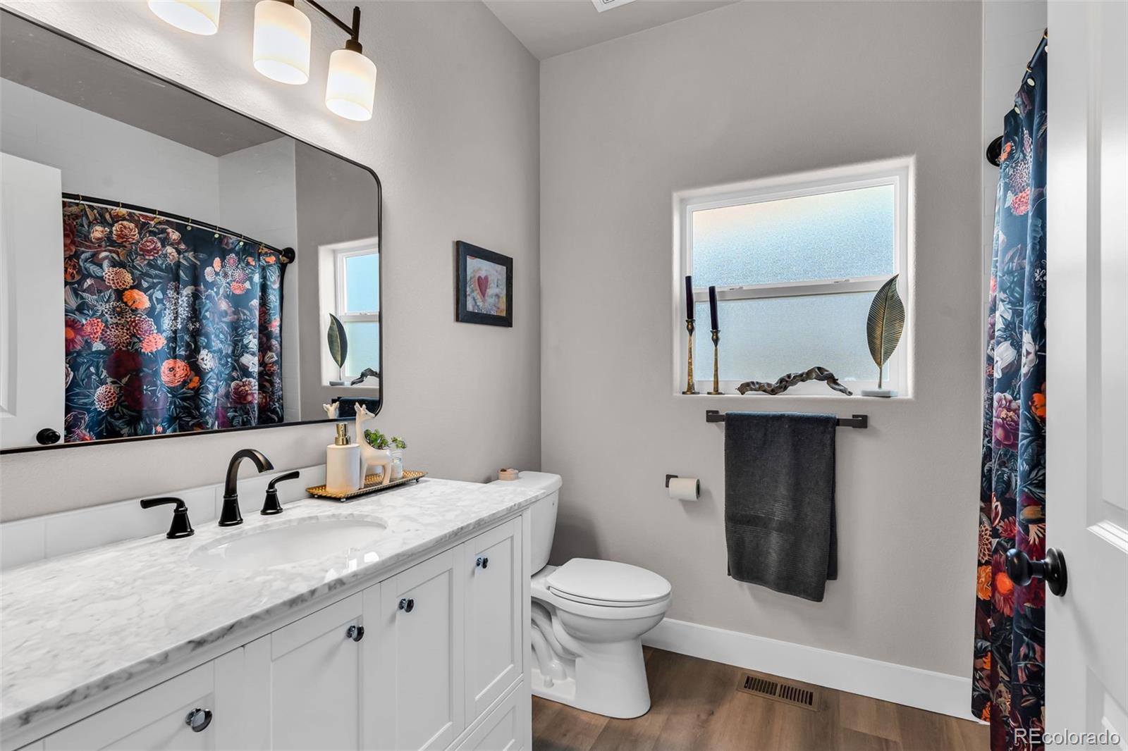 425 Miners Road Canon City, CO 81212 - Photo 26 of 33 a bathroom with a toilet sink and mirror