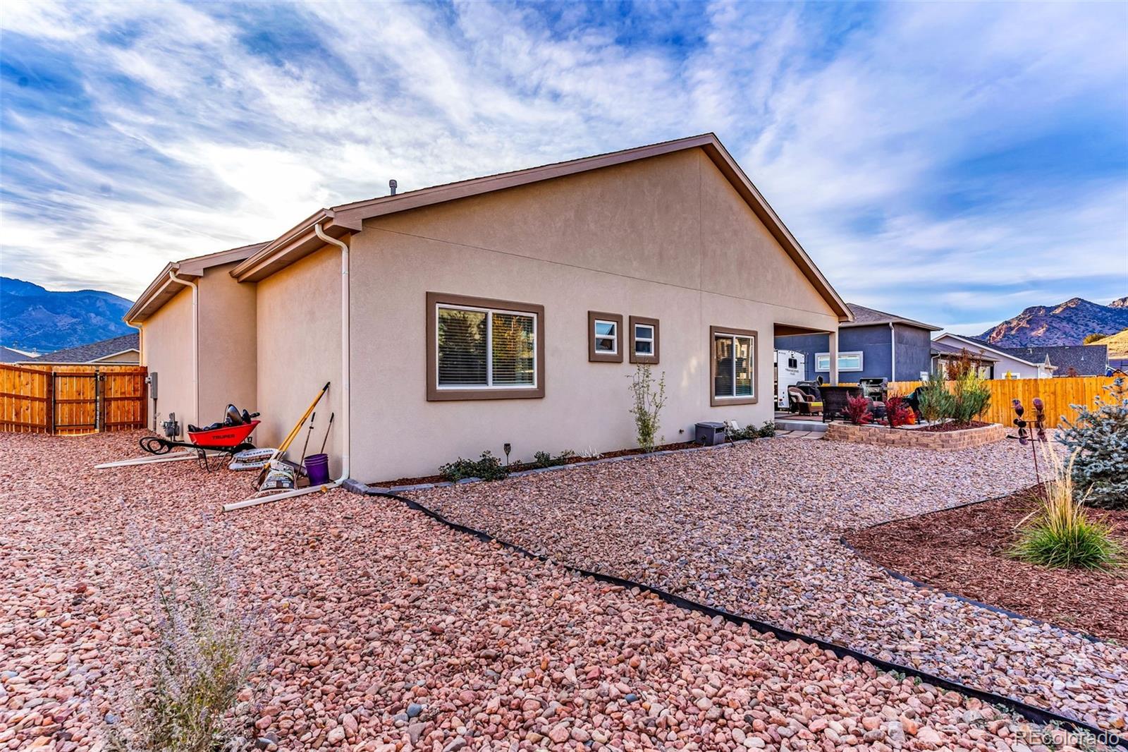 425 Miners Road Canon City, CO 81212 - Photo 33 of 33 a backyard of a house with barbeque oven table and chairs
