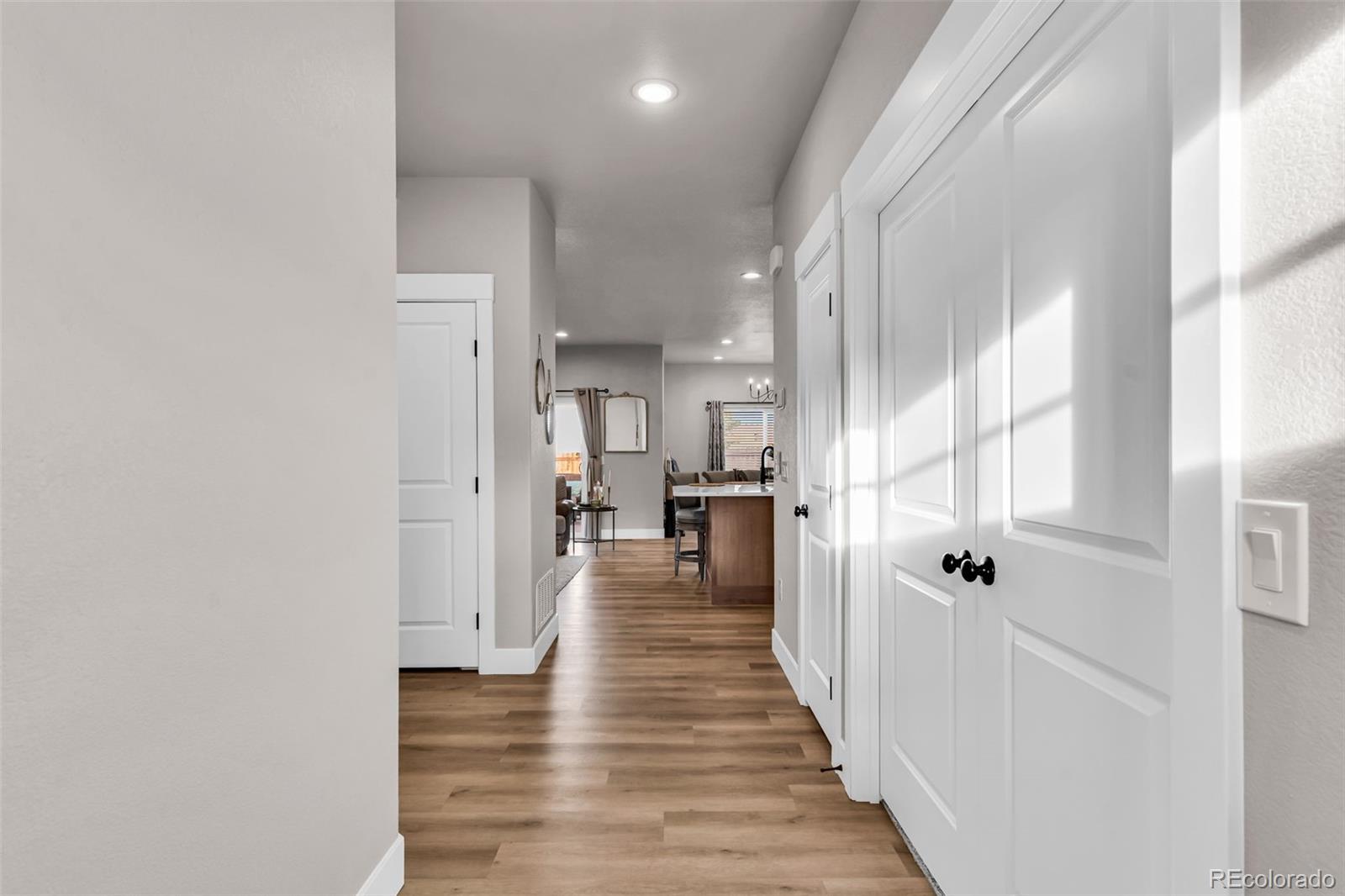 425 Miners Road Canon City, CO 81212 - Photo 7 of 33 a view of a hallway with wooden floor and a bathroom