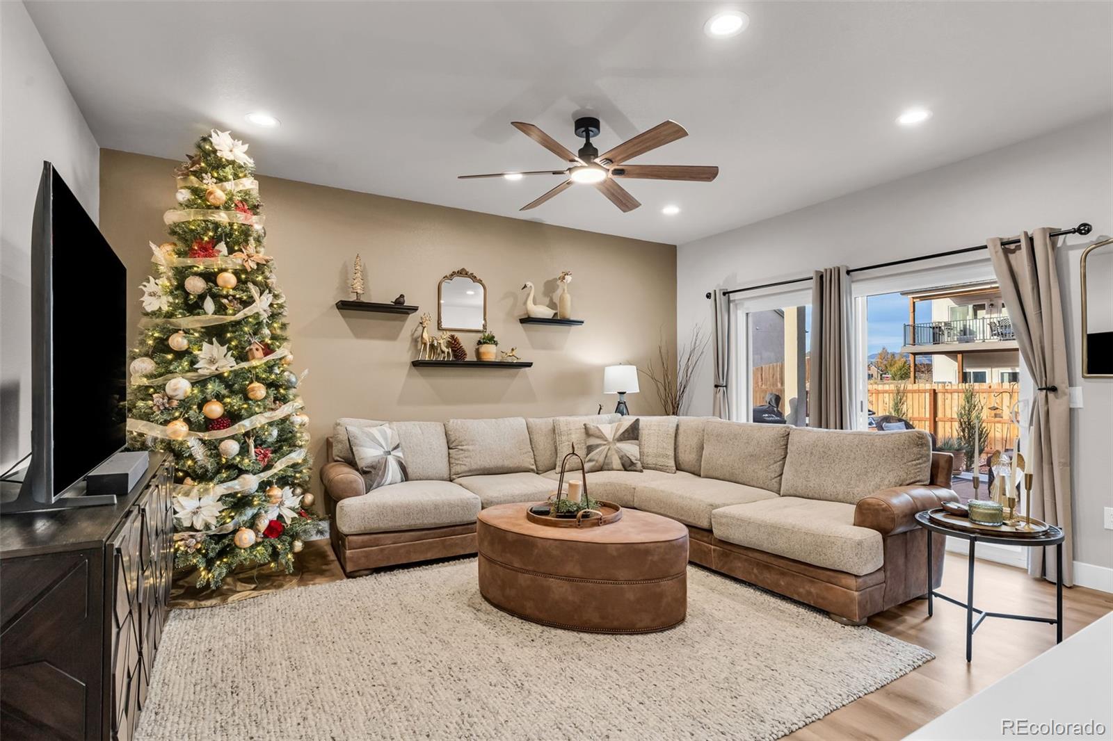 425 Miners Road Canon City, CO 81212 - Photo 9 of 33 a living room with furniture and a flat screen tv