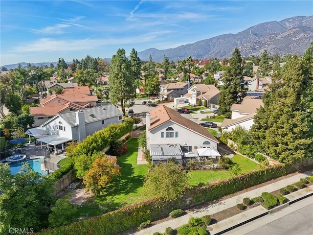 an aerial view of residential houses and outdoor space