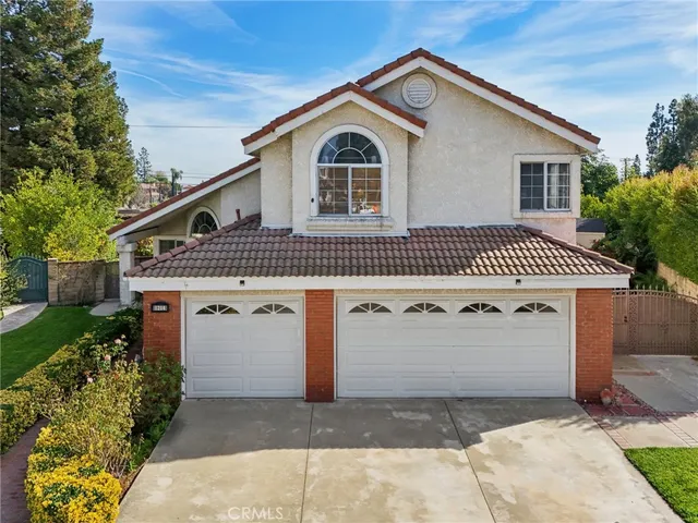 a front view of a house with a garage