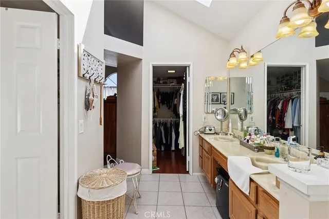 a bathroom with a sink double vanity and a mirror