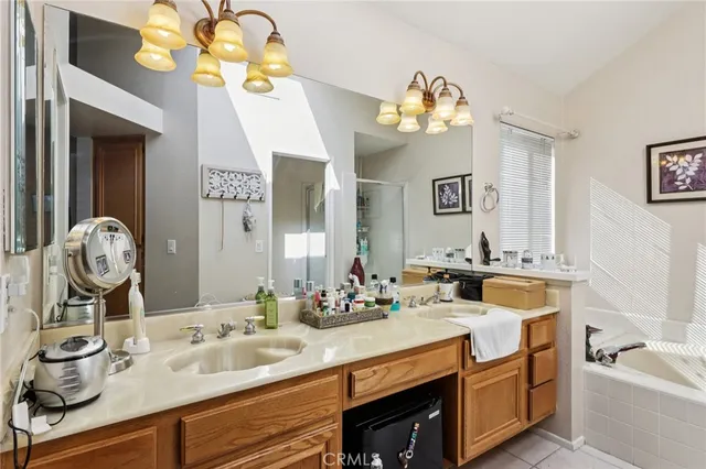a bathroom with a sink double vanity and a mirror