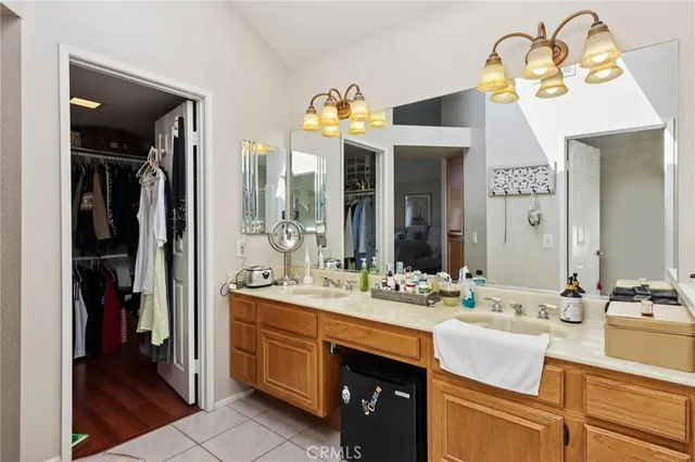 a bedroom with a bed and a mirror