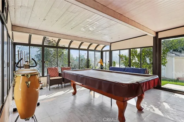 a bathroom with a tub sink mirror and vanity