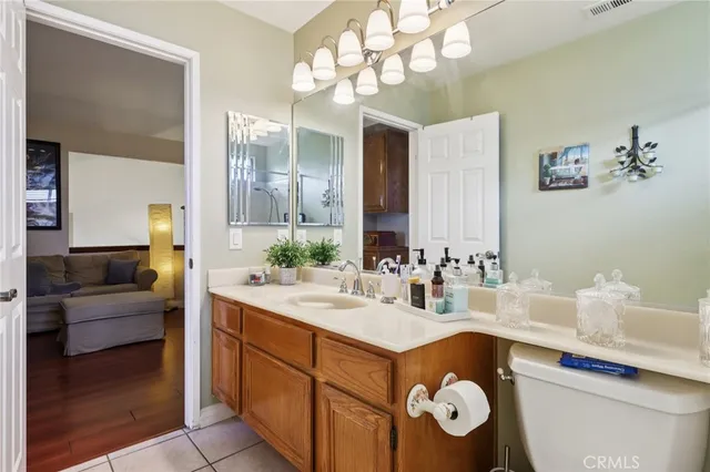 a bathroom with a sink a vanity and a mirror