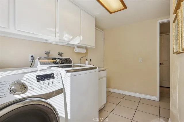a kitchen with a sink and a stove top oven