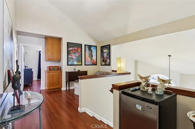 a kitchen with a sink cabinets and wooden floor