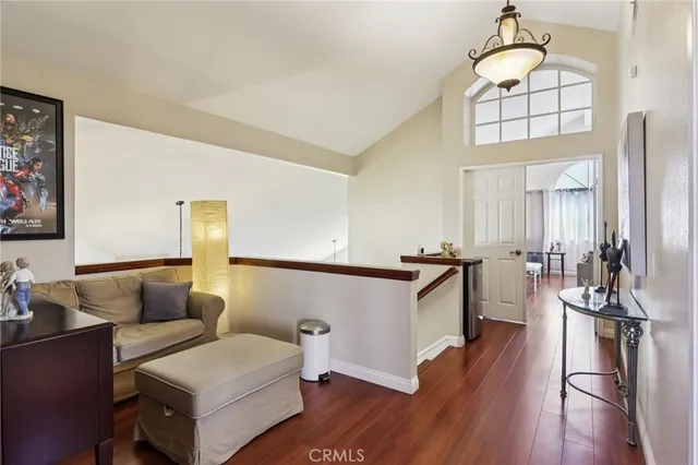 a kitchen with a sink cabinets and wooden floor