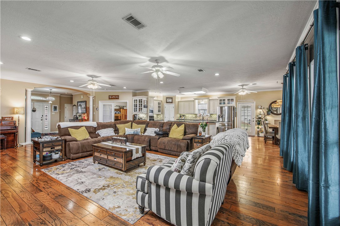 7 Hickory Ridge Lane Hilltop Lakes, TX 77871 - Photo 11 of 37 a living room with lots of furniture and wooden floor