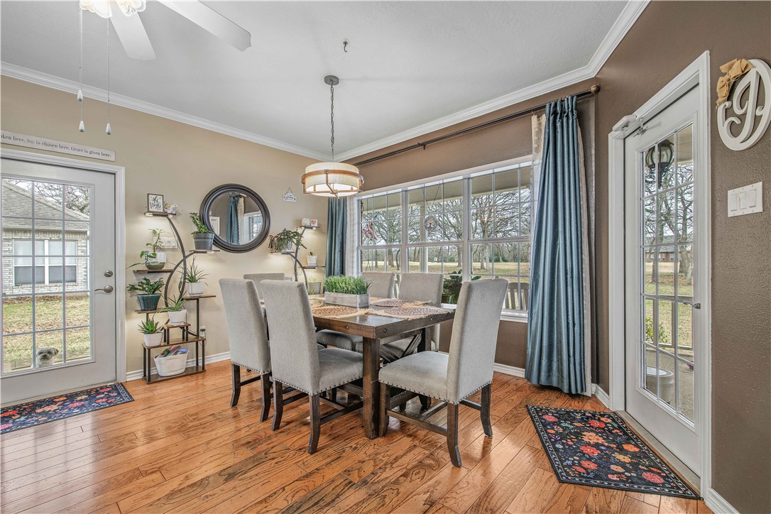 7 Hickory Ridge Lane Hilltop Lakes, TX 77871 - Photo 13 of 37 a view of a dining room with furniture window and wooden floor