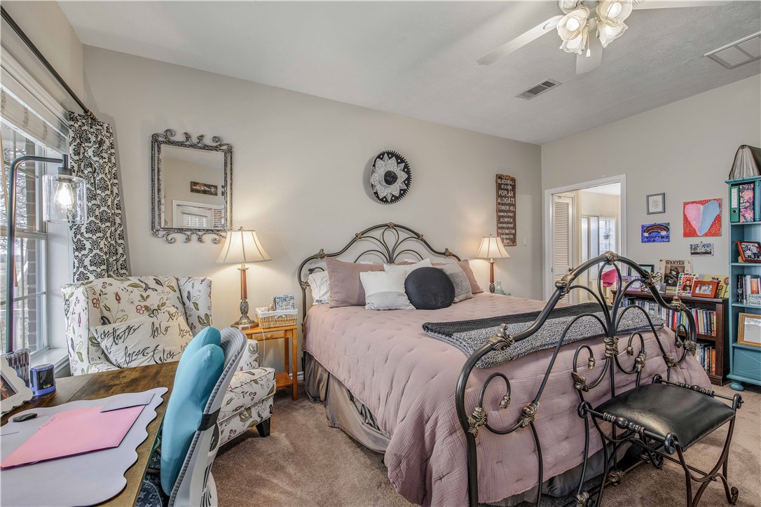 7 Hickory Ridge Lane Hilltop Lakes, TX 77871 - Photo 21 of 37 a bedroom with bed and a chandelier
