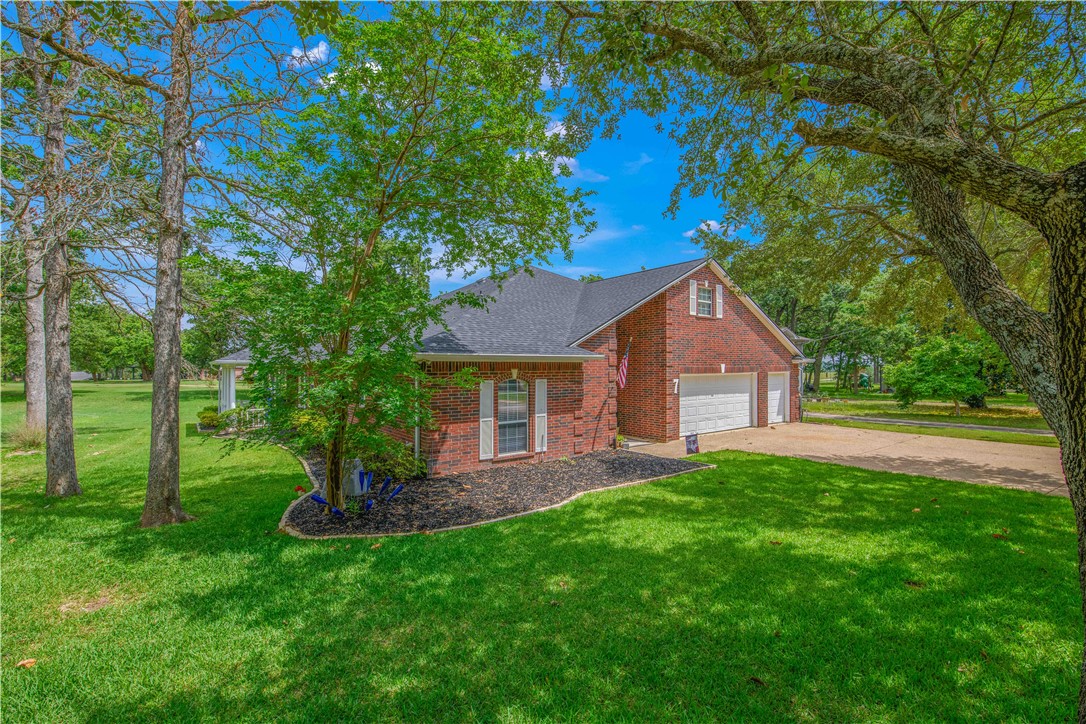 7 Hickory Ridge Lane Hilltop Lakes, TX 77871 - Photo 3 of 37 a house view with a garden space